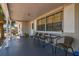 Inviting front porch with seating, providing a welcoming outdoor space to relax at 7535 Christina Ln, Port Richey, FL 34668