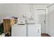 Convenient laundry area with washer and dryer, offering practicality and efficiency at 7535 Christina Ln, Port Richey, FL 34668