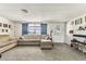 Cozy living room with comfortable seating, soft carpeting, and a welcoming atmosphere at 7535 Christina Ln, Port Richey, FL 34668