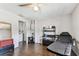 Functional room with an adjacent laundry area, showcasing practicality with the wood-look flooring at 7535 Christina Ln, Port Richey, FL 34668
