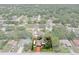 Spacious suburban property showcasing lush, mature trees surrounding a cozy home, with a long driveway and verdant lawn at 7630 Landmark Dr, Spring Hill, FL 34606