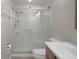 Tiled walk-in shower with a built-in seat in updated bathroom at 7630 Landmark Dr, Spring Hill, FL 34606