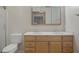 Bathroom with double sink vanity, and a large mirror at 7630 Landmark Dr, Spring Hill, FL 34606