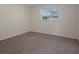Bedroom with neutral carpet and a sunlit window at 7630 Landmark Dr, Spring Hill, FL 34606