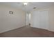 Neutral bedroom features include a ceiling fan, closet, and soft carpeting at 7630 Landmark Dr, Spring Hill, FL 34606