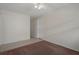 View of bedroom with tiled floor flowing into carpeted area with neutral wall color at 7630 Landmark Dr, Spring Hill, FL 34606