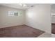 Bedroom with neutral walls and carpeting, complemented by a bright window at 7630 Landmark Dr, Spring Hill, FL 34606