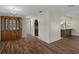 Open-concept dining room with hardwood floors and views to the kitchen at 7630 Landmark Dr, Spring Hill, FL 34606