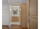 Hallway featuring storage cabinets and a view of the bathroom at 7630 Landmark Dr, Spring Hill, FL 34606