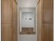 Hallway storage cabinets with mirror leading to additional storage at 7630 Landmark Dr, Spring Hill, FL 34606