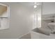 The laundry room has a window for natural light, and tile flooring at 7630 Landmark Dr, Spring Hill, FL 34606
