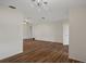 Open-concept living room with hardwood floors and recessed lighting at 7630 Landmark Dr, Spring Hill, FL 34606