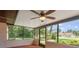 Screened-in porch offering an airy outdoor experience with views of the beautifully landscaped backyard at 7630 Landmark Dr, Spring Hill, FL 34606