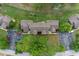 Aerial view of the community shows parking spaces, greenery, and surrounding landscape at 7682 St Andrews Blvd, Weeki Wachee, FL 34613