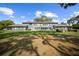 This building features a large backyard with a well-manicured lawn and mature landscaping at 7682 St Andrews Blvd, Weeki Wachee, FL 34613