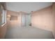 Bedroom featuring neutral carpet, and a spacious closet at 7682 St Andrews Blvd, Weeki Wachee, FL 34613