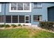 The exterior features a walk-out patio with screen door and manicured lawn at 7682 St Andrews Blvd, Weeki Wachee, FL 34613