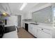 Functional kitchen with white cabinets and stainless steel sink at 7682 St Andrews Blvd, Weeki Wachee, FL 34613