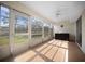 Spacious enclosed lanai with tiled floors and peaceful outdoor views at 7682 St Andrews Blvd, Weeki Wachee, FL 34613