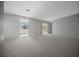 Open living area leading to an adjacent room with lots of natural light at 7682 St Andrews Blvd, Weeki Wachee, FL 34613