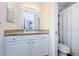 Cozy bathroom with granite countertop vanity, mirror, drawers and cabinets for storage, and toilet at 7807 Hardwick Dr # 123, New Port Richey, FL 34653
