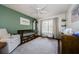 Charming bedroom with hardwood floors, ceiling fan, natural light, and custom paint job at 7807 Hardwick Dr # 123, New Port Richey, FL 34653