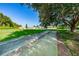 Community bocce ball court with a well-kept playing surface and lush surroundings, perfect for outdoor recreation at 7807 Hardwick Dr # 123, New Port Richey, FL 34653