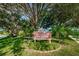 Millpond Estates entrance sign surrounded by flower beds and trees, creating a welcoming atmosphere at 7807 Hardwick Dr # 123, New Port Richey, FL 34653