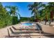 Serene hot tub area surrounded by lush landscaping, offering a private and relaxing spa experience at 7807 Hardwick Dr # 123, New Port Richey, FL 34653