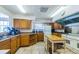 Kitchen area with ample cabinetry, countertops, and appliances at the Millpond Estates clubhouse at 7807 Hardwick Dr # 123, New Port Richey, FL 34653