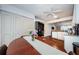 Bright kitchen and dining area with wood floors, appliances, shelving, and plenty of storage at 7807 Hardwick Dr # 123, New Port Richey, FL 34653