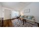 Inviting living room with hardwood floors, plenty of natural light, and a comfortable sofa at 7807 Hardwick Dr # 123, New Port Richey, FL 34653