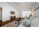 Relaxing living room featuring a flat screen television, couch, and hardwood floors at 7807 Hardwick Dr # 123, New Port Richey, FL 34653