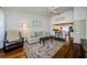 Cozy living room featuring hardwood floors and view into kitchen at 7807 Hardwick Dr # 123, New Port Richey, FL 34653
