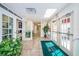 Welcoming entrance lobby with tile floors, glass doors, and a welcome mat at the Millpond Estates clubhouse at 7807 Hardwick Dr # 123, New Port Richey, FL 34653