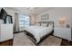 Spacious main bedroom with hardwood floors, ceiling fan, lots of natural light, and a modern design at 7807 Hardwick Dr # 123, New Port Richey, FL 34653