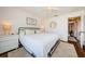 Bright main bedroom features hardwood floors, ceiling fan, lots of natural light, and closet at 7807 Hardwick Dr # 123, New Port Richey, FL 34653