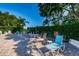 Serene pool deck featuring comfortable seating and lush landscaping, ideal for relaxation and community enjoyment at 7807 Hardwick Dr # 123, New Port Richey, FL 34653