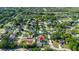 The property features an aerial view of a backyard pool and is located in a lush, green neighborhood at 8388 Maltby Rd, Spring Hill, FL 34606