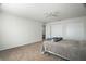Carpeted bedroom featuring bed and closet space at 8388 Maltby Rd, Spring Hill, FL 34606