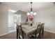 Dining room with view of eat-in kitchen and main hall that features updated flooring at 8388 Maltby Rd, Spring Hill, FL 34606