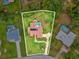 An aerial view of the property showing large yard with pool and mature landscaping at 8393 Delaware Dr, Weeki Wachee, FL 34607