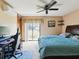 Bedroom with sliding glass doors that provide plenty of natural light and an outdoor view at 8393 Delaware Dr, Weeki Wachee, FL 34607