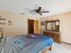 Cozy bedroom featuring a dresser, ceiling fan, and a serene atmosphere at 8393 Delaware Dr, Weeki Wachee, FL 34607