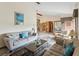 Comfortable living room with two sofas and decor, showcasing the open layout to the dining area and kitchen at 8393 Delaware Dr, Weeki Wachee, FL 34607