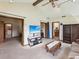 Bright living room features high ceilings, exposed beams, and multiple entry points at 8393 Delaware Dr, Weeki Wachee, FL 34607