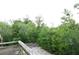 Backyard featuring a deck overlooking lush greenery at 8568 Heather Blvd, Weeki Wachee, FL 34613