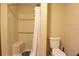 Standard bathroom featuring a toilet, shower and shower curtain at 8568 Heather Blvd, Weeki Wachee, FL 34613