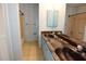 Bathroom with a double sink vanity and two separate shower/tub areas at 8568 Heather Blvd, Weeki Wachee, FL 34613