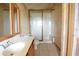 Bathroom featuring a glass-enclosed shower, vanity, and toilet at 8568 Heather Blvd, Weeki Wachee, FL 34613